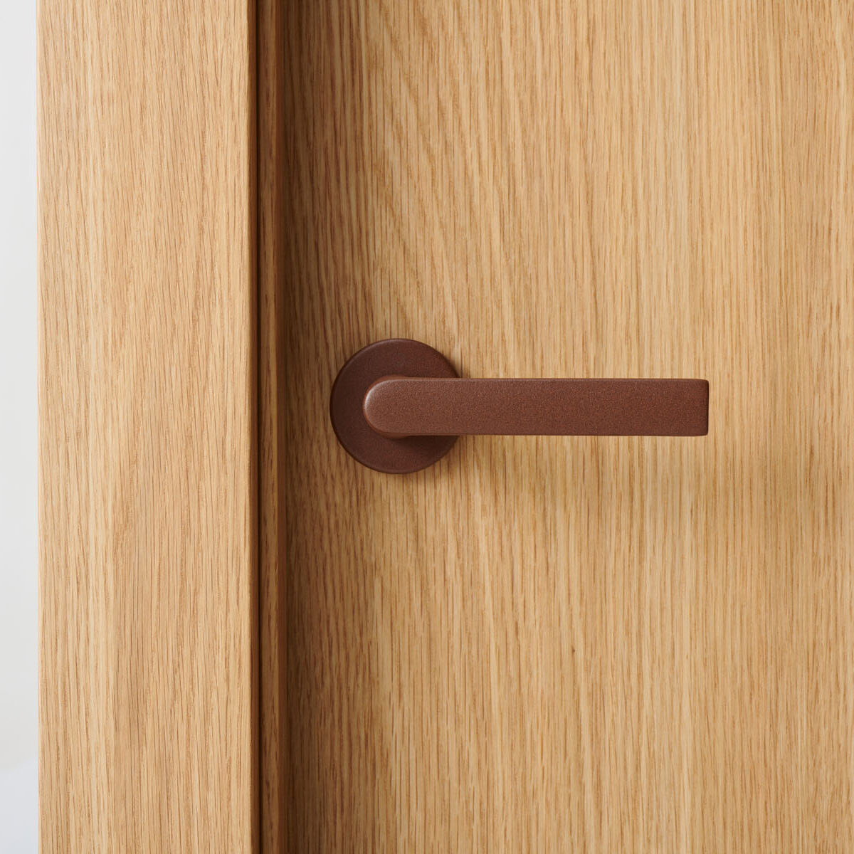 Hoja Roble Pure con manivela Hoppe Óxido texturizado