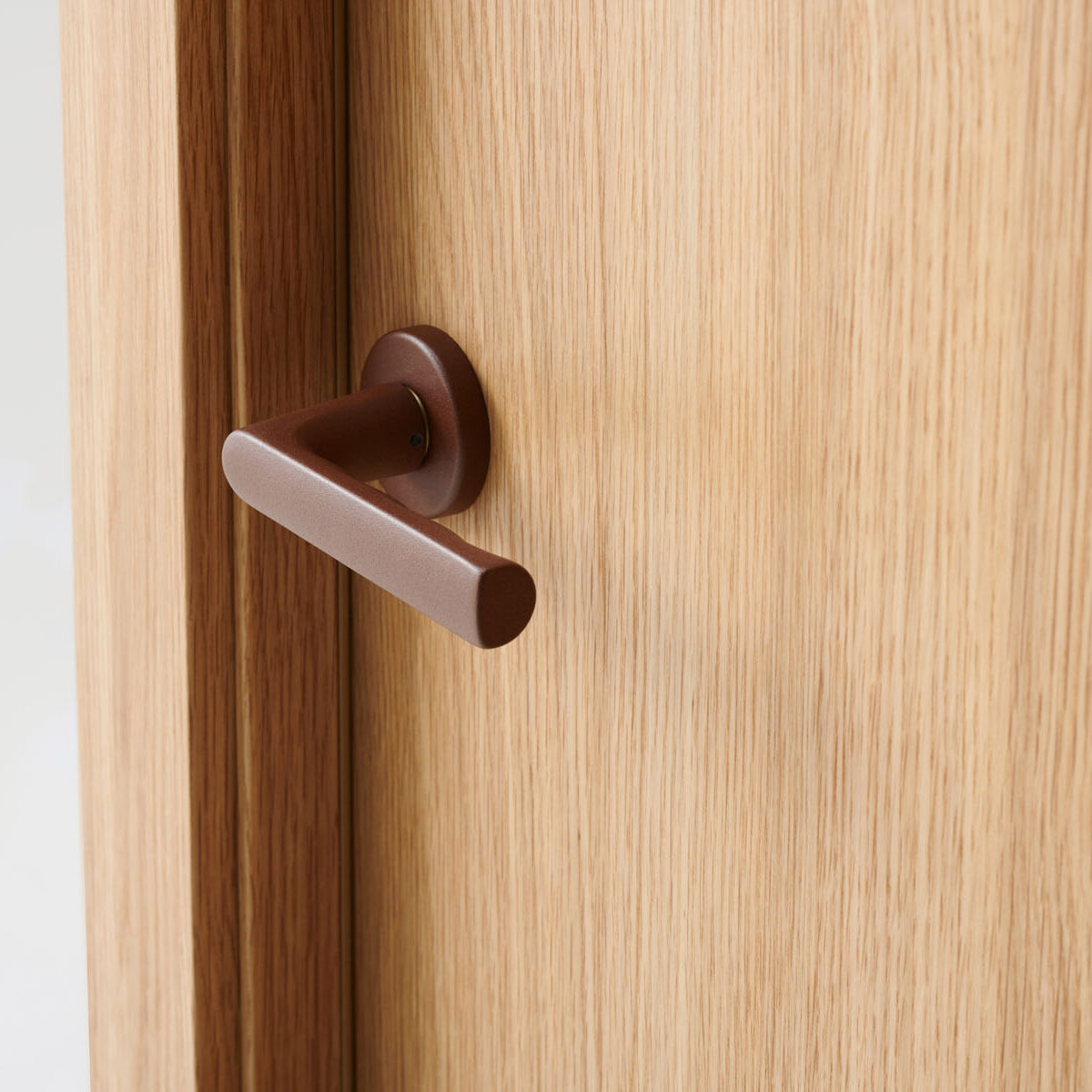 Hoja Roble Pure con manivela Hoppe Óxido texturizado